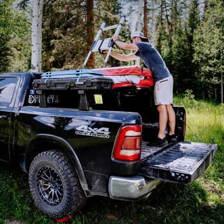 Rooftop tent mounts on a rugged Ford F-150 setup