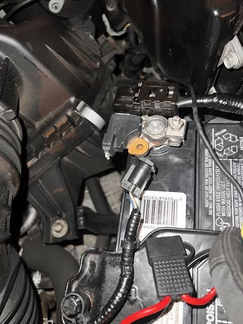 Defective unsealed battery sensor mechanism showing terminal contacts