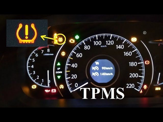 A dashboard showing a blinking tire pressure warning light in a Honda CR-V