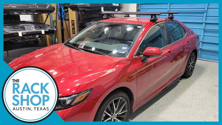Close-up of Toyota Camry roof crossbar attachment and load testing