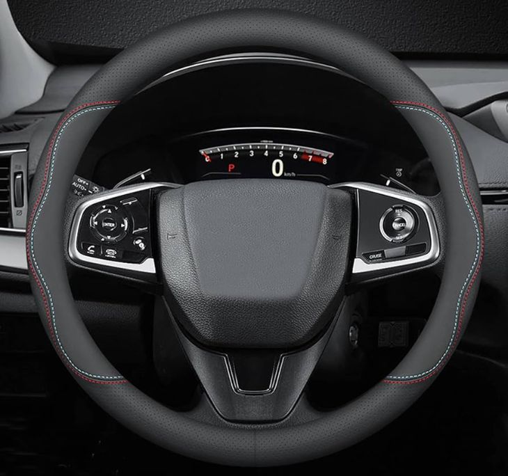 Toyota Camry steering wheel cover installed on leather wheel