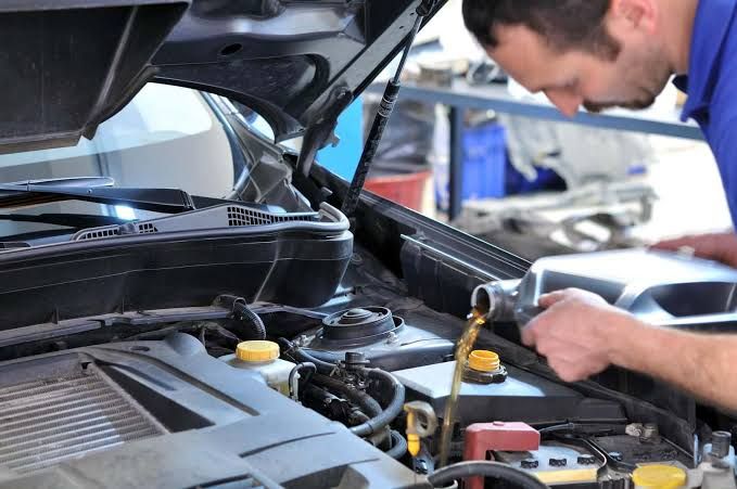 Under hood view of 2018 Toyota RAV4 engine bay showing oil fill cap location